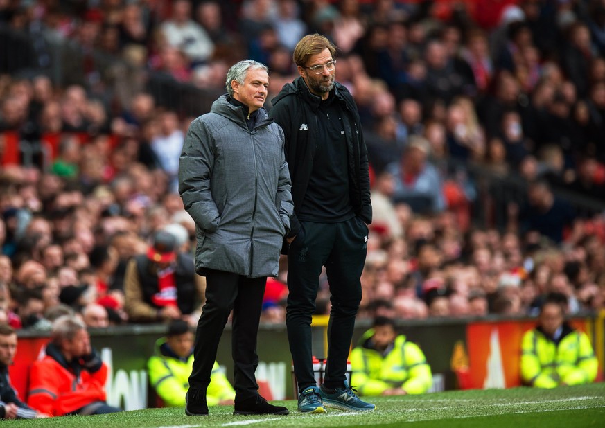 epa06593675 Manchester United manager Jose Mourinho (L) and Liverpool manager Juergen Klopp (R) react during the English Premier League soccer match between Manchester United and Liverpool FC at the O ...