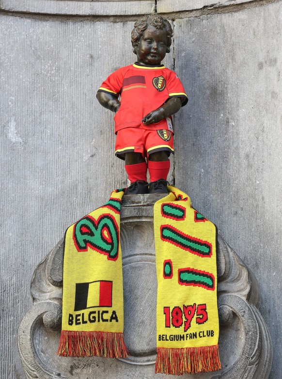 Eines der Wahrzeichen der belgischen Hauptstadt, der Manneken Pis, hat das WM-Fieber gepackt. Der kleine wasserlassende Mann von Brüssel trägt voller Stolz das belgische Nationaltrikot. Die «roten Teu ...