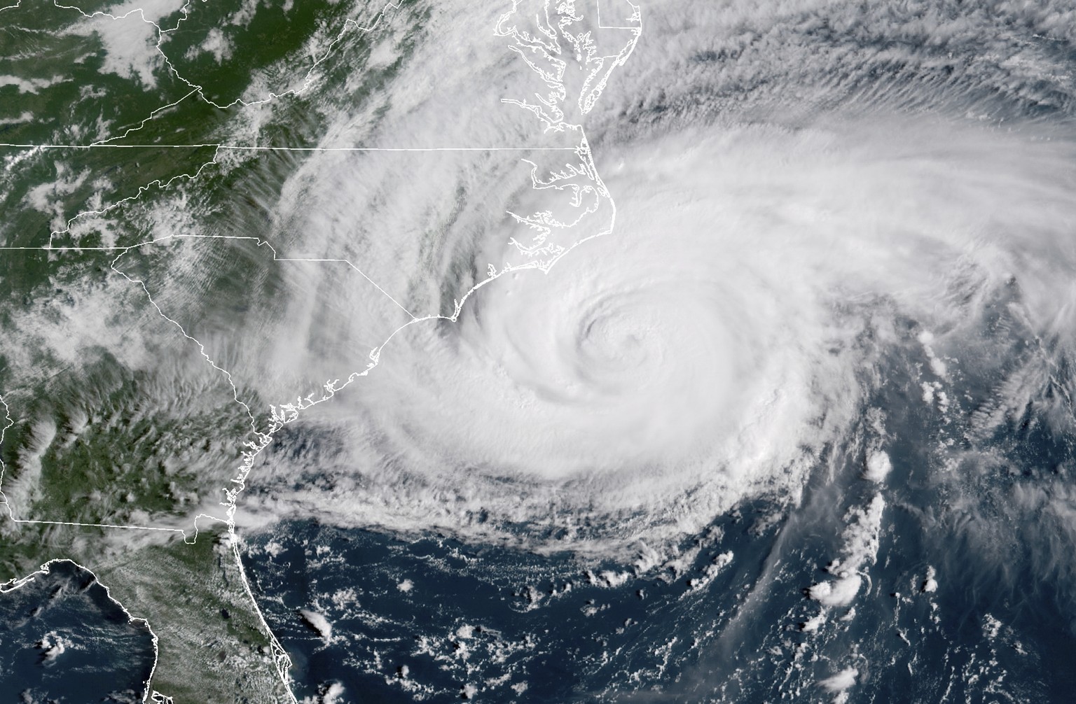 This satellite image provided by NOAA shows Hurricane Florence on the eastern coast of the United States on Friday, Sept. 14, 2018. (NOAA via AP)