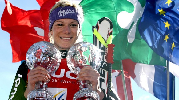 epa04133481 (FILE) A file picture dated 13 March 2008 shows Germany&#039;s Maria Riesch posing with her crystal globe trophies on the podium after winning the women&#039;s overall Super-G and the Supe ...