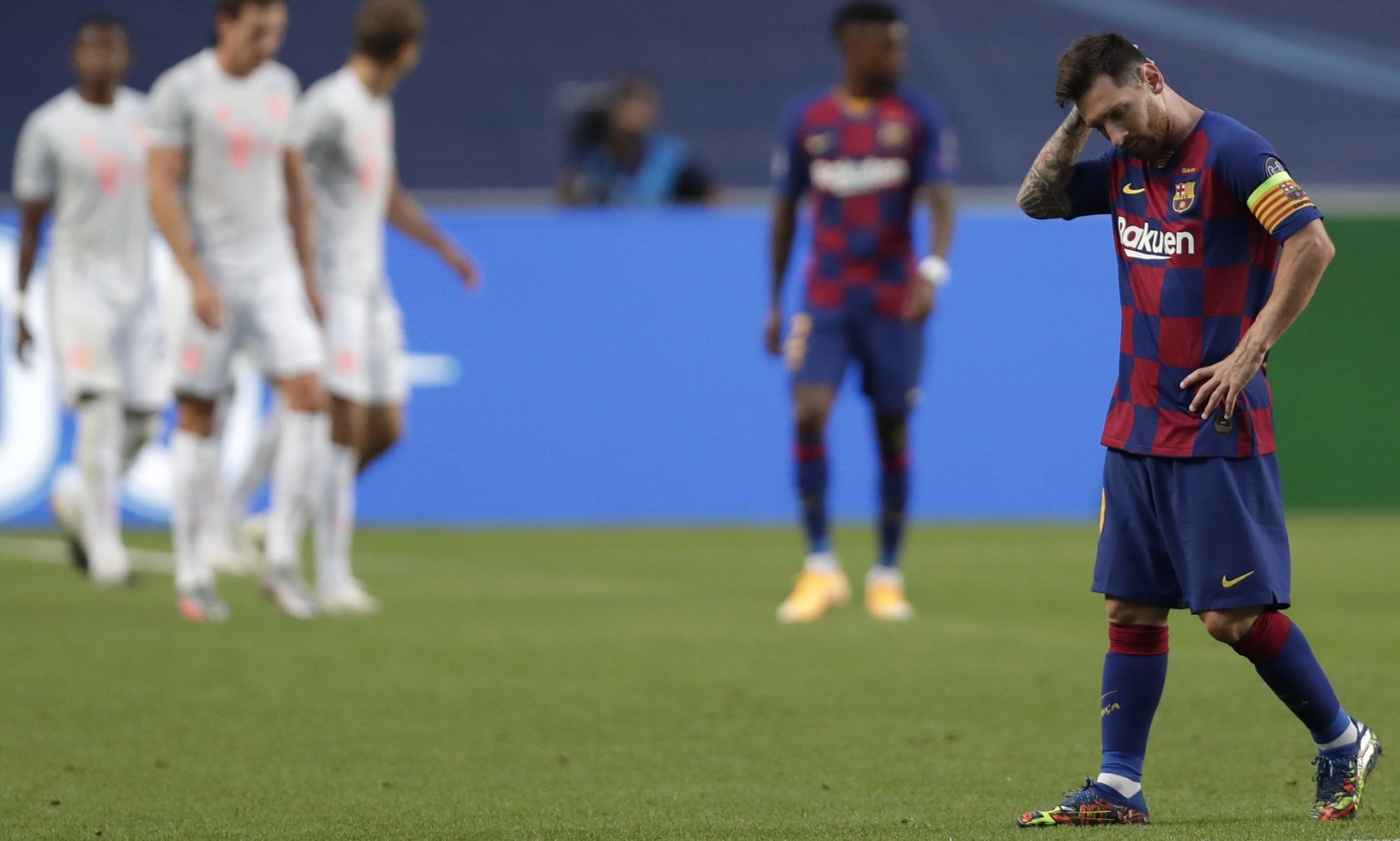 Barcelona&#039;s Lionel Messi holds his head during the Champions League quarterfinal match between FC Barcelona and Bayern Munich at the Luz stadium in Lisbon, Portugal, Friday, Aug. 14, 2020. Gerard ...