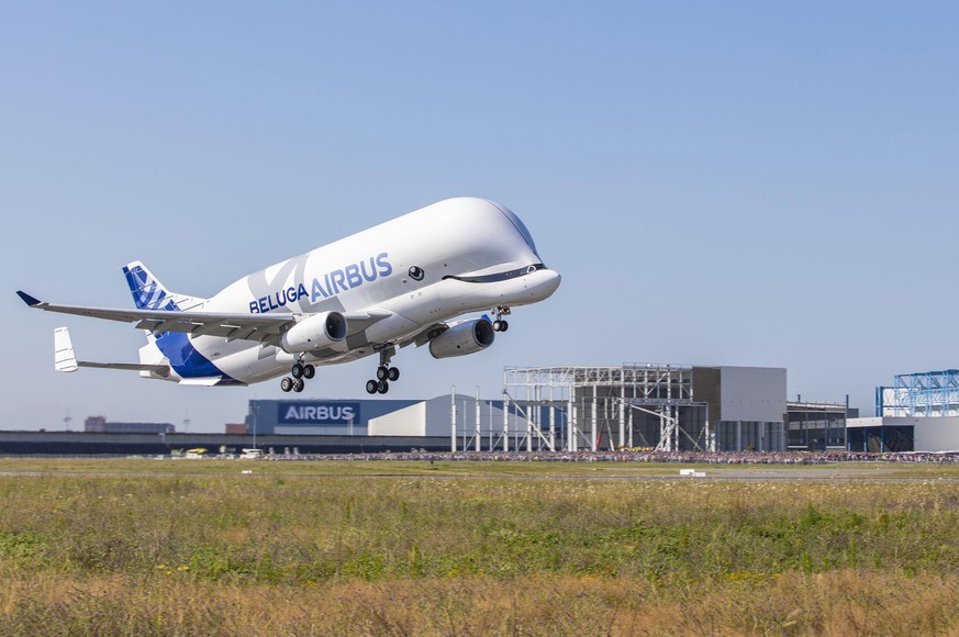 epa06898451 A handout photo made available by Airbus media department on 19 July 2018 shows an Airbus Beluga XL transport plane during its first flight event in Colomiers near Toulouse, France, 19 Jul ...