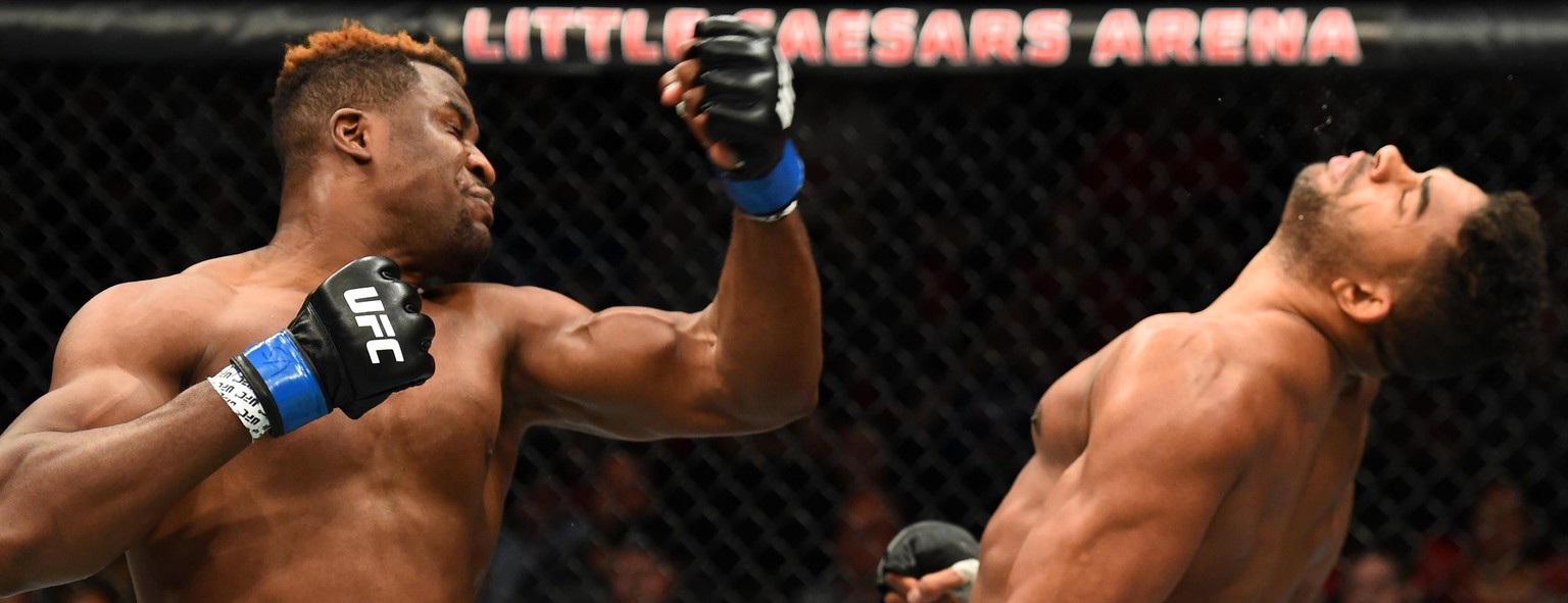 DETROIT, MI - DECEMBER 02: (L-R) Francis Ngannou of Cameroon punches Alistair Overeem of The Netherlands in their heavyweight bout during the UFC 218 event inside Little Caesars Arena on December 02,  ...