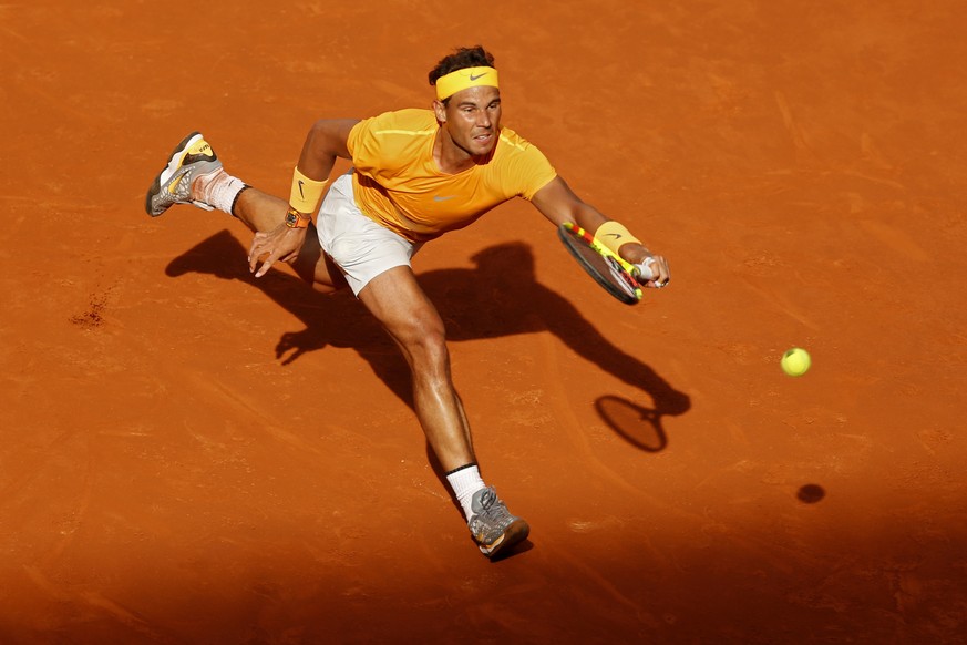 Rafael Nadal from Spain misses a ball from Dominic Thiem from Austria at the end of a Madrid Open tennis tournament match in Madrid, Spain, Friday, May 11, 2018. Thiem won 7-5, 6-3. (AP Photo/Francisc ...