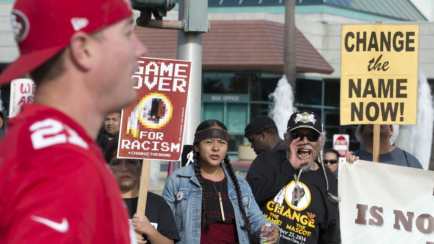 Native Americans demonstrate in front of fans arriving for the San Francisco 49ers vs. the Washington Redskins game at Levi s Stadium in Santa Clara, California on November 23, 2014. The group was ask ...