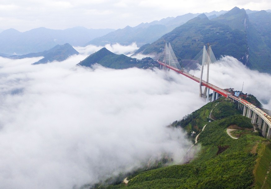 In this photo taken Saturday Sept. 10, 2016, an aerial view of Beipanjiang Bridge across the Beipanjiang valley is seen in Shuicheng county in southwest China&#039;s Guizhou province. According to loc ...