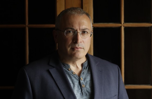 FILE - In this Tuesday, July 24, 2018 file photo, Russian opposition figure Mikhail Khodorkovsky, the former owner of the Yukos Oil Company, poses for a photograph after being interviewed by The Assoc ...