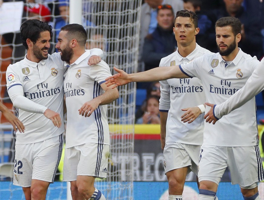 epa05884749 Real Madrid&#039;s Spanish midfielder Isco (L) celebrates with Carvajal (2L), Cristiano Ronaldo (2R) and Nacho after scoring the 2-0 goal against Deportivo Alaves during a Spanish Primera  ...
