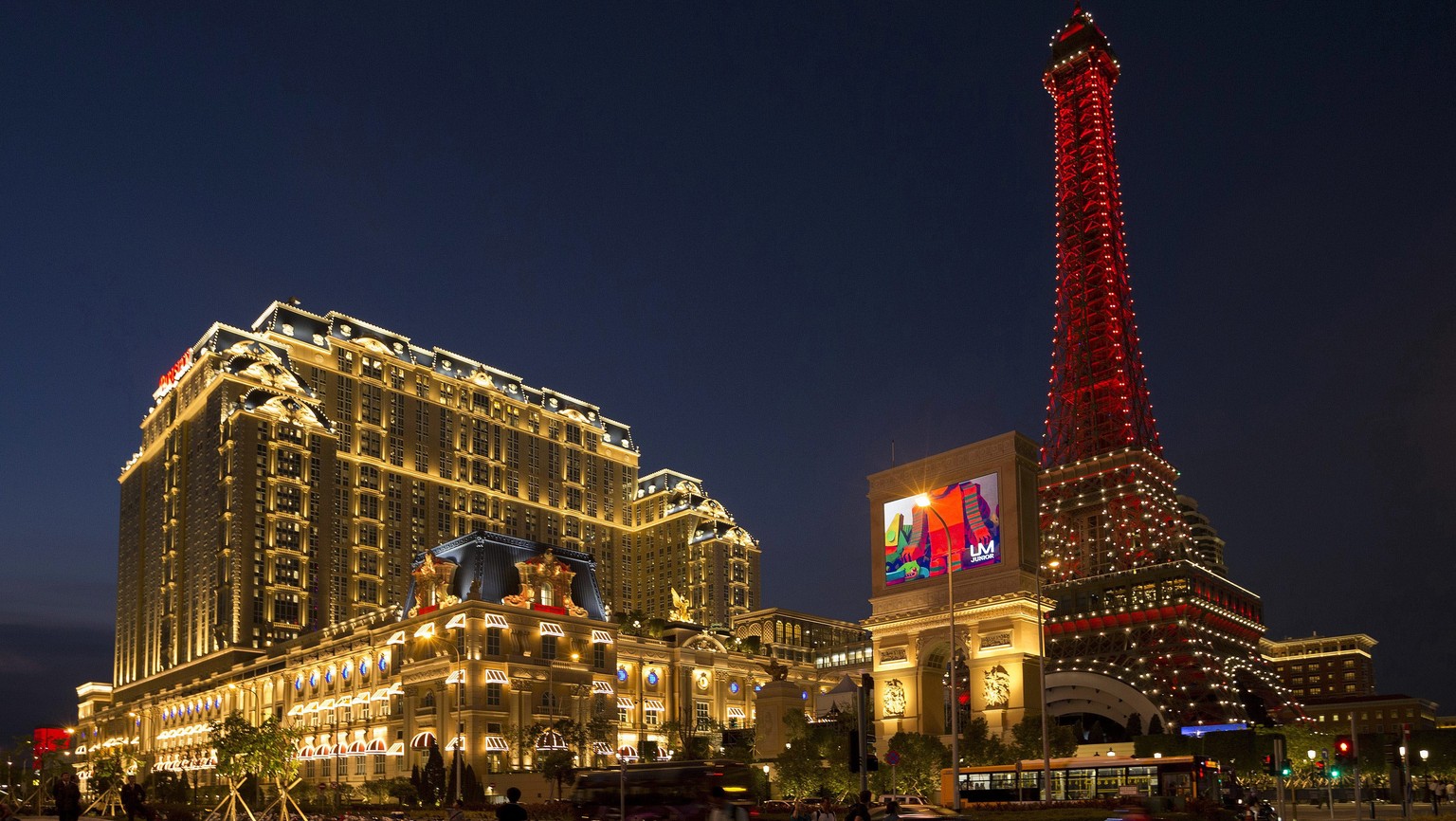 epa05537848 The new luxury hotel resort &#039;Parisian&#039;, owned by American casino magnate Sheldon Adelson, illuminated as it opens in Macao, China, 13 September 2016. The new hotel resort inspire ...
