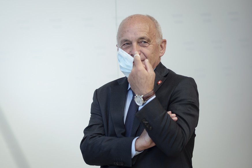epa08624226 Swiss Finance Minister and Federal Councillor Ueli Maurer checks his protective face mask after a press conference of the German Speaking Countries&#039;s Finance ministers meeting in Vien ...