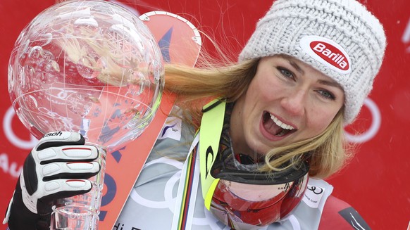 United States&#039;s Mikaela Shiffrin holds the women&#039;s World Cup overall trophy, at the alpine ski World Cup finals in Are, Sweden, Sunday, March 18, 2018. (AP Photo/Marco Trovati)