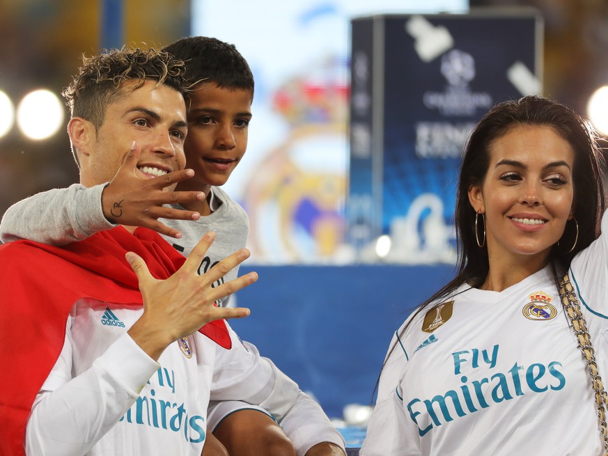 epa06765905 Cristiano Ronaldo of Real Madrid and his son Cristiano Ronaldo Jr. and girlfriend Georgina Rodriguez celebrate after the UEFA Champions League final between Real Madrid and Liverpool FC at ...