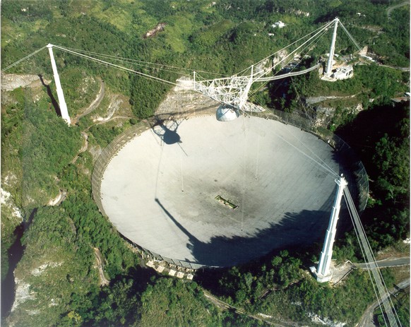 This undated handout photo provided by Seth Shostak, SETI Institute, shows the Arecibo radio telescope in Puerto Rico. The world’s largest single antenna, it has a million watt transmitter. Astronomer ...