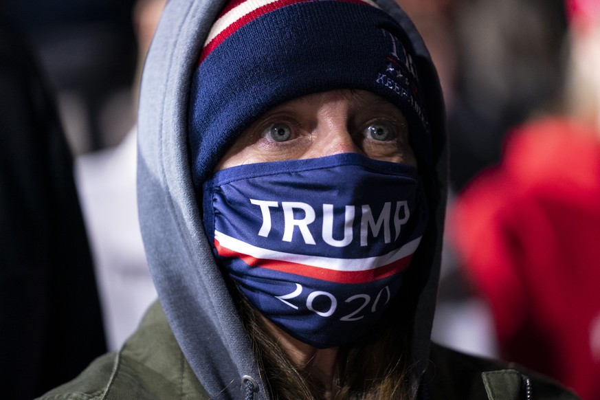 A supporter of President Donald Trump listens to him speak at a campaign rally at Central Wisconsin Airport, Thursday, Sept. 17, 2020, in Mosinee, Wis. (AP Photo/Evan Vucci)
Donald Trump