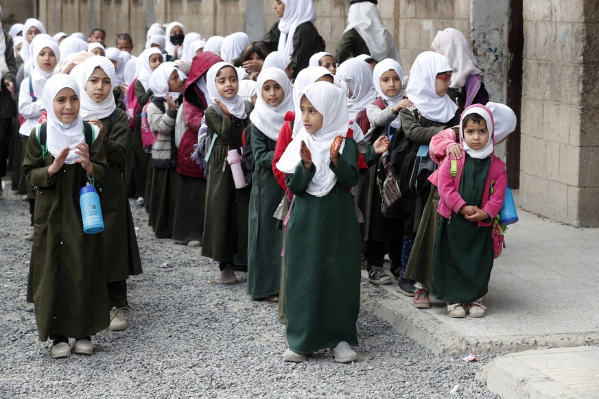 epa08842422 Yemeni schoolgirls do light exercises before attending classes at a primary school in Sana���a, Yemen, 25 November 2020. According to UN statistics, the prolonged conflict in Yemen has adv ...