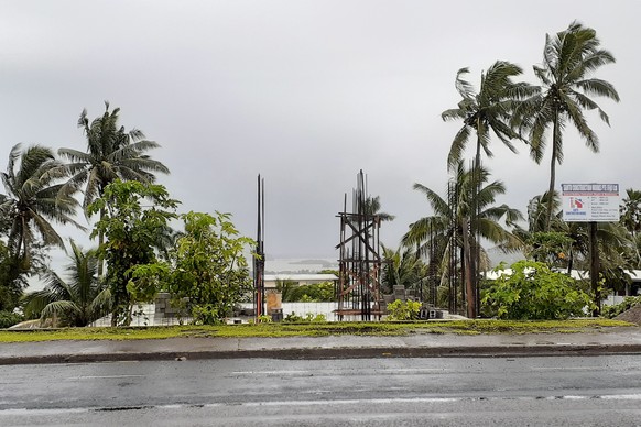 The sky is clouded over in the distance as intermittent rain and wind continue at Suva Harbour in Suva, Fiji, Friday, Dec. 18, 2020. Dozens of homes have been destroyed by a cyclone Yasa which hit the ...