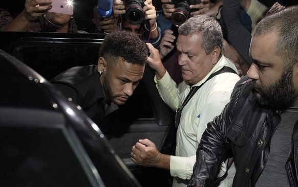 Brazilian soccer player Neymar leaves the police station where he arrived shortly before in Rio de Janeiro, Brazil, Thursday, June 6, 2019. Rio de Janeiro police said Thursday that soccer star Neymar  ...