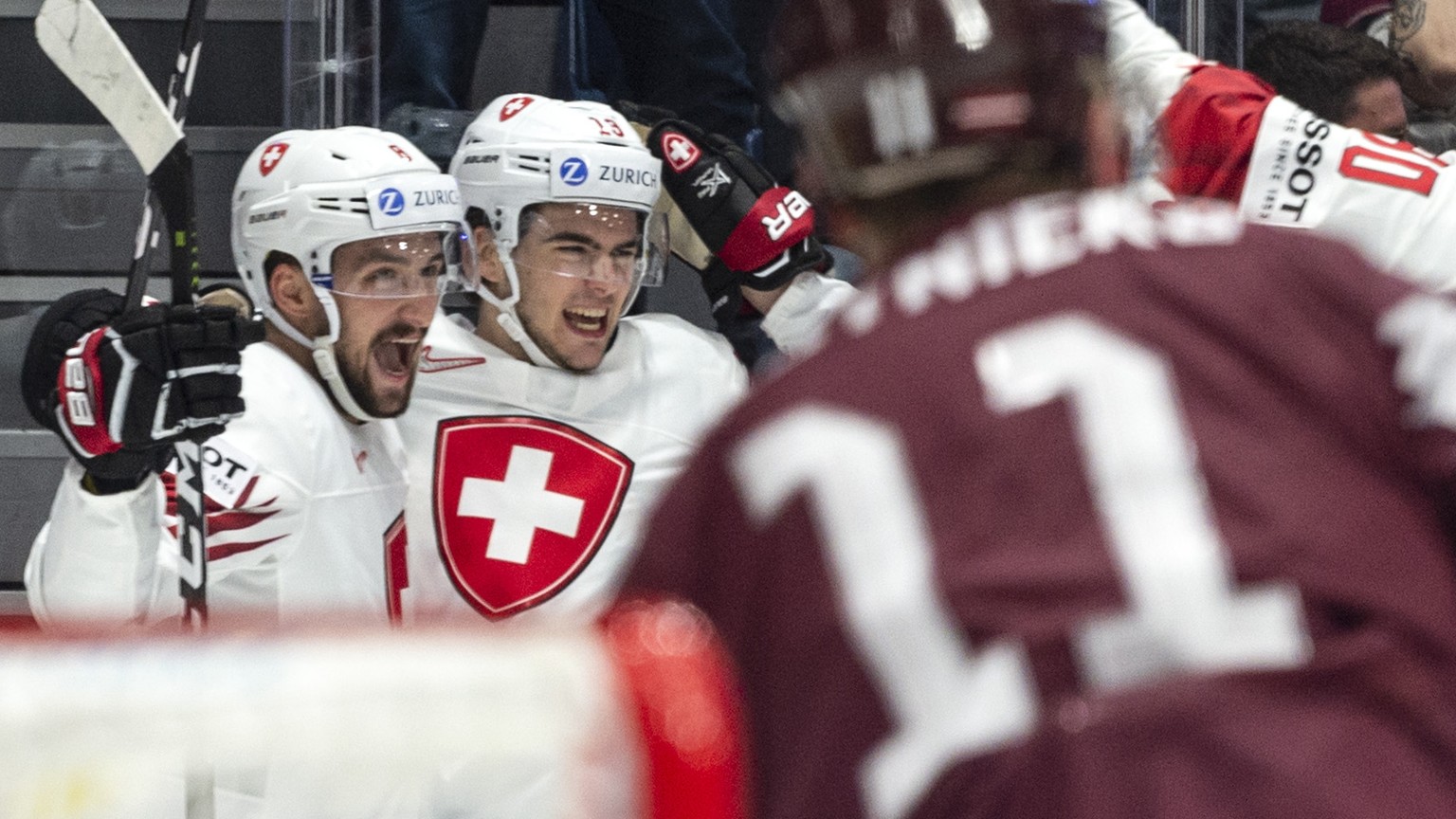 Switzerland&#039;s Nico Hischier, middle, and the team celebrate after scoring the 2:1 during the game between Latvia and Switzerland, at the IIHF 2019 World Ice Hockey Championships, at the Ondrej Ne ...