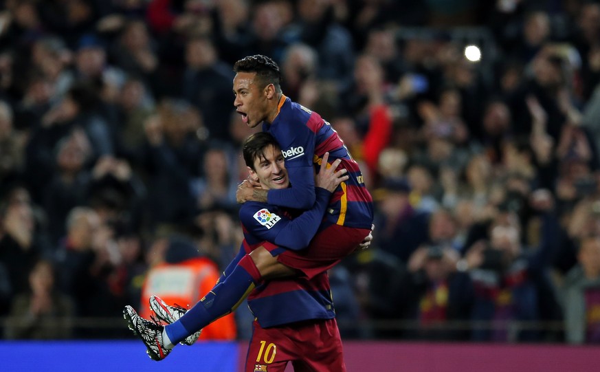FILE - In this Feb. 28, 2016, file photo, FC Barcelona&#039;s Lionel Messi, left, celebrates after scoring against Sevilla with his teammate Neymar during a Spanish La Liga soccer match at the Camp No ...