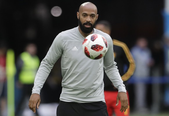 Belgium assistant coach Thierry Henry eyes the ball prior to the semifinal match between France and Belgium at the 2018 soccer World Cup in the St. Petersburg Stadium, in St. Petersburg, Russia, Tuesd ...