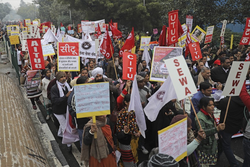 Trade union members march during a general strike called by various trade unions, in New Delhi, India, Wednesday, Jan. 8, 2020. Trade unions have called for a country-wide strike Wednesday to protest  ...