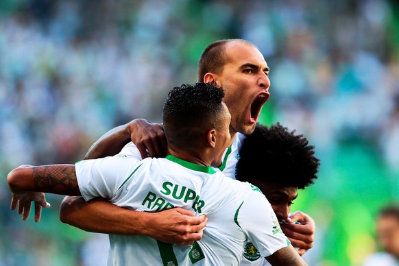 epa07746355 Sporting&#039;s Bas Dost (C) celebrates with his teammates after scoring a goal during the Trofeu Cinco Violinos (Five Violin Trophy) soccer match between Sporting Lisbon and Valencia CF i ...