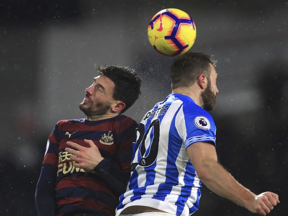 Newcastle United&#039;s Fabian Schar,left, and Huddersfield Town&#039;s Laurent Depoitre battle for the ball during the English Premier League soccer match between Huddersfield Town and Newcastle at t ...