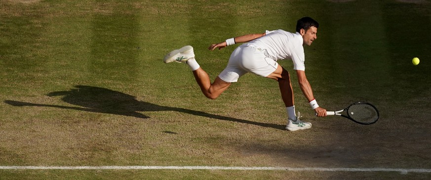 epaselect epa07717206 Novak Djokovic of Serbia in action against Roger Federer of Switzerland during their Men&#039;s final match for the Wimbledon Championships at the All England Lawn Tennis Club, i ...