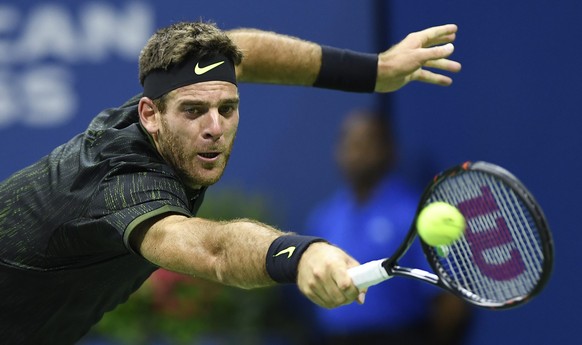 epa05529631 Juan Martin del Potro of Argentina hits a return to Stan Wawrinka of Switzerland during their quarterfinals round match on the tenth day of the US Open Tennis Championships at the USTA Nat ...