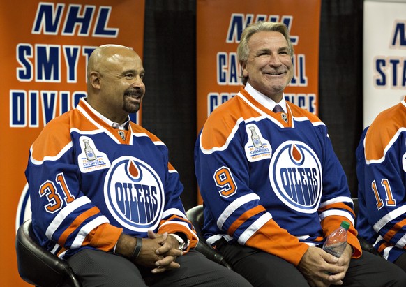 Former Edmonton Oilers&#039; Grant Fuhr, left, and Glenn Anderson take part in the 1984 Stanley Cup NHL hockey reunion media availability in Edmonton, Alberta, Wednesday, Oct. 8, 2014. (AP Photo/The C ...