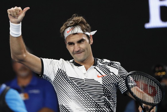 Switzerland&#039;s Roger Federer celebrates his win over Japan&#039;s Kei Nishikori during their fourth round match at the Australian Open tennis championships in Melbourne, Australia, Sunday, Jan. 22 ...