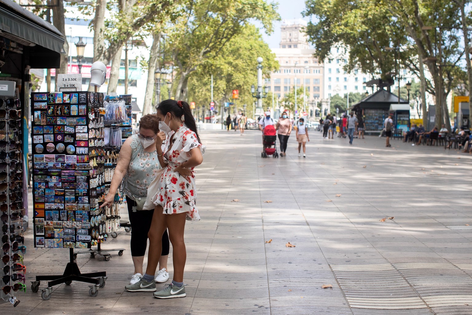 epa08576734 An unusually empty Ramblas street in Barcelona, Spain, 31 July 2020. Restrictions imposed in Barcelona due to new coronavirus Covid-19 outbreaks is affecting tourism in the region, reports ...