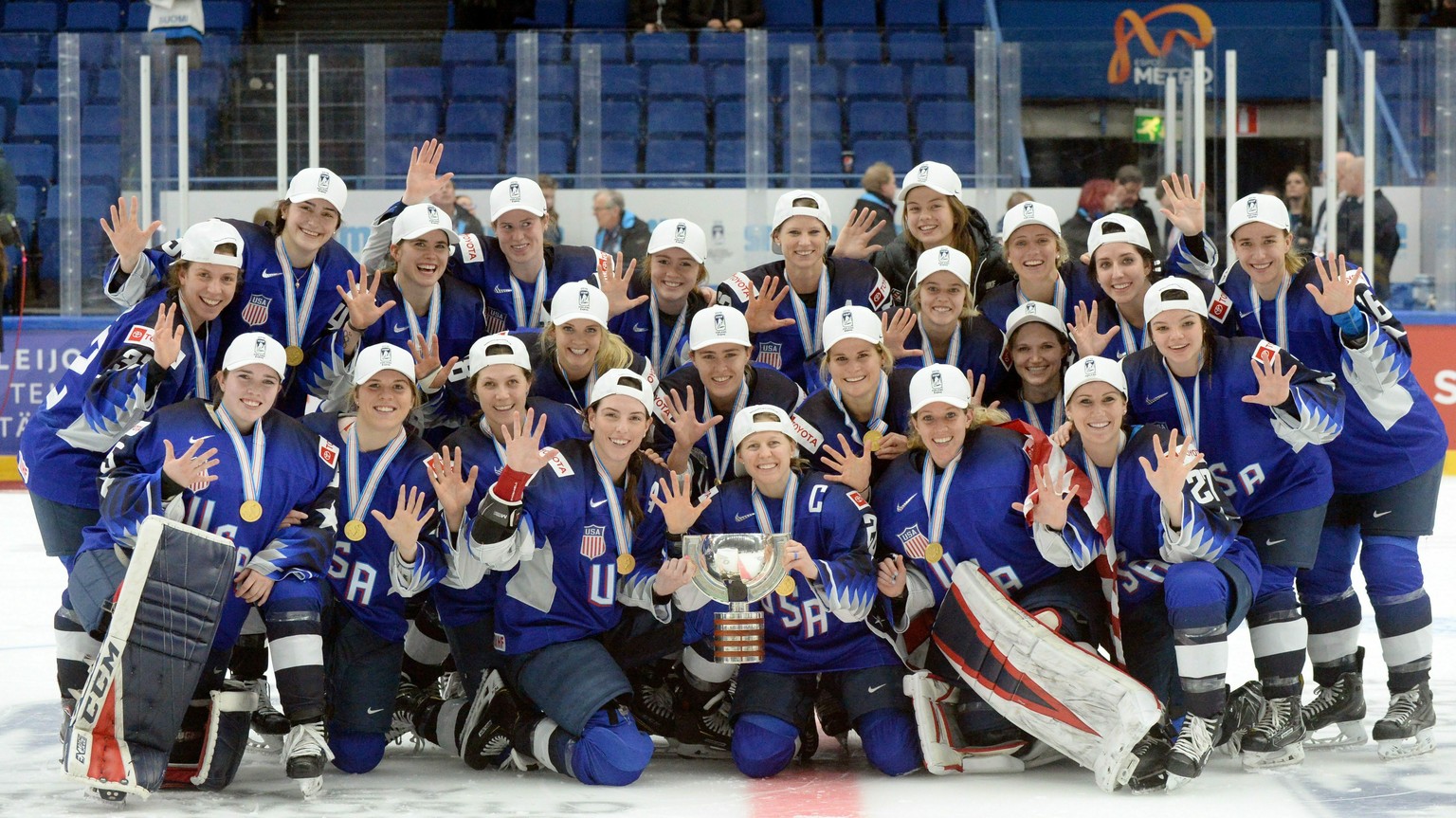 The US team pose with their gold medals during the medal ceremony after their 2-1 shootout victory in the IIHF Women&#039;s Ice Hockey World Championships final match between the United States and Fin ...