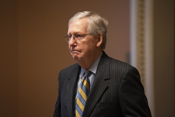 epa08127577 Republican Senate Majority Leader Mitch McConnell walks to his office before opening the Senate on Capitol Hill in Washington, DC, USA, 14 January 2020. The Senate impeachment trial agains ...