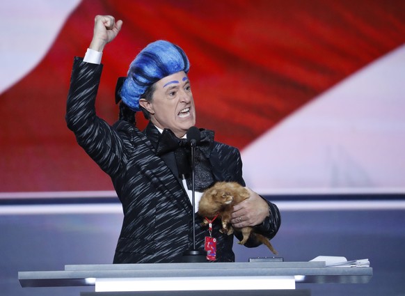 Comedian Stephen Colbert clowns around on the stage at the Republican National Convention in Cleveland, Sunday, July 17, 2016. (AP Photo/J. Scott Applewhite)