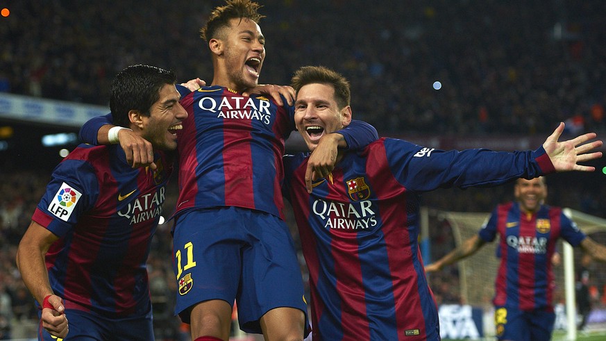 FILE - In this Sunday, Jan. 11, 2015 file photo, FC Barcelona&#039;s Lionel Messi, right, Neymar, center, and Luis Suarez, celebrate after scoring against Atletico Madrid during a Spanish La Liga socc ...