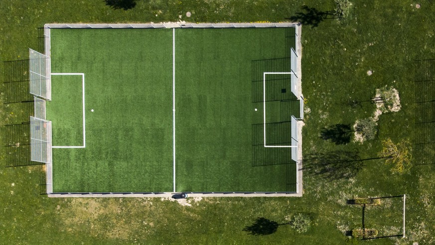 epa08364459 A picture taken with a drone shows empty basketball court and Synthetic football pitches in Cossonay, Switzerland, 15 April 2020. Switzerland is under lockdown till 26 April in a bid to qu ...