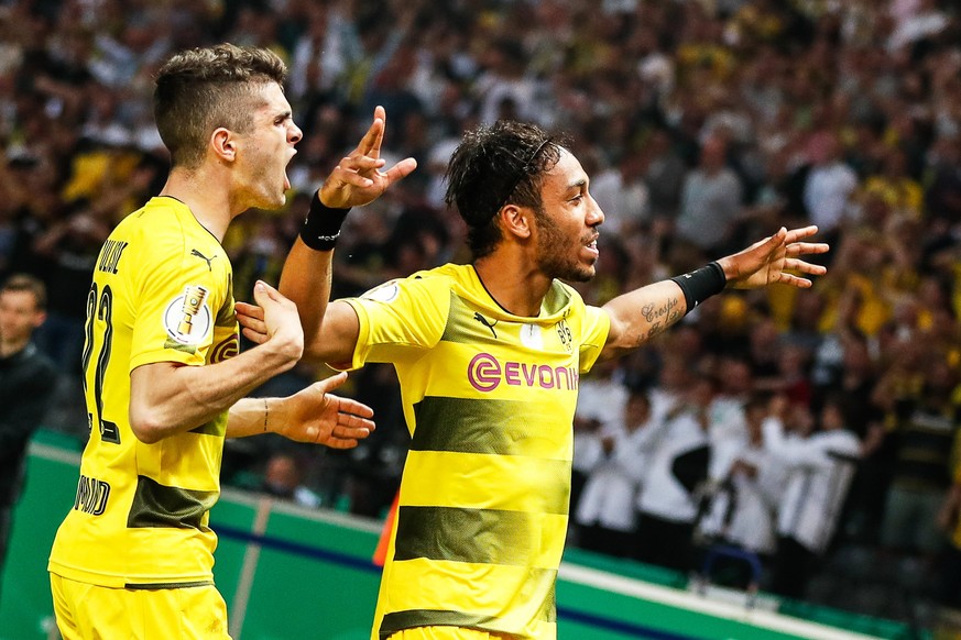 epa05994181 Dortmund&#039;s Pierre-Emerick Aubameyang (R) celebrates with his teammate Christian Pulisic (L) after scoring the 2-1 lead from the penalty spot during the German DFB Cup final soccer mat ...