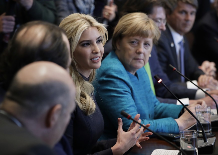 In this Friday, March 17, 2017, photo, German Chancellor Angela Merkel listens as Ivanka Trump speaks during a meeting with President Donald Trump at the White House in Washington. Ivanka Trump is pla ...