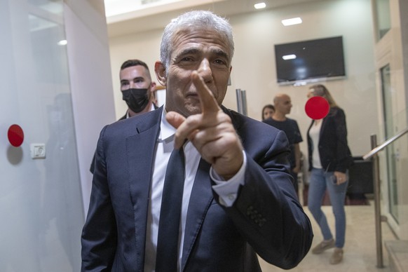 REPLACES COMMON GOOD INSTEAD OF COMMON GROUND - Israeli opposition leader Yair Lapid, arrives for a news conference in Tel Aviv, Thursday, May. 6, 2021. Lapid called on his potential partners to find  ...