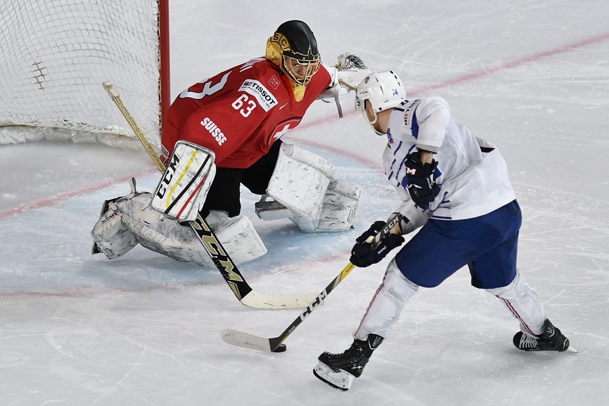 epa05953629 France’s Stephane da Costa, right, scores with a penalty shoot against Switzerland&#039;s goaltender Leonardo Genoni during a penalty shoot during their Ice Hockey World Championship group ...