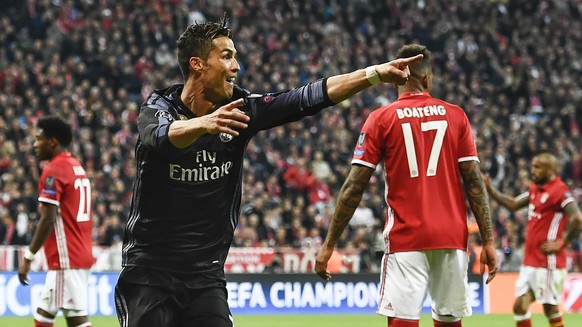 epa05905143 Real Madrid&#039;s Cristiano Ronaldo celebrates after scoring the 2-1 lead during the UEFA Champions League quarter final, first leg soccer match between FC Bayern Munich and Real Madrid a ...