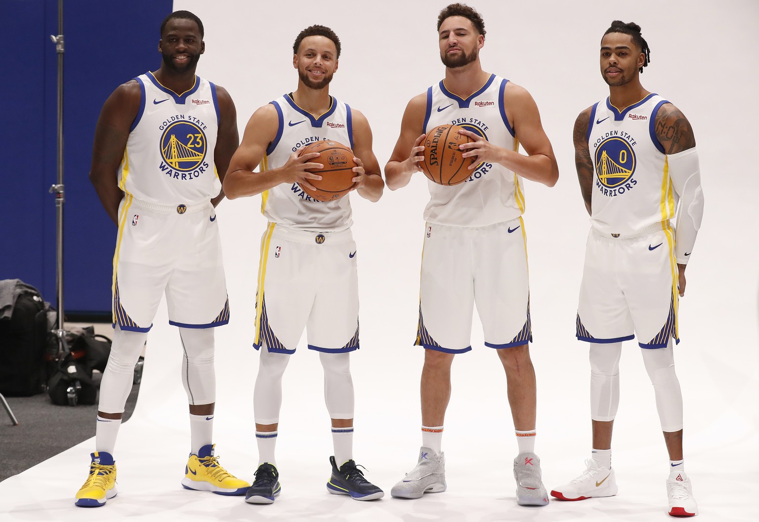 epa07883845 Golden State Warriors guard Stephen Curry (2-L), Klay Thompson (2-R), Warriors forward Draymond Green (L), and Warriors guard D?ïAngelo Russell (R) pose for a photo during the Golden State ...