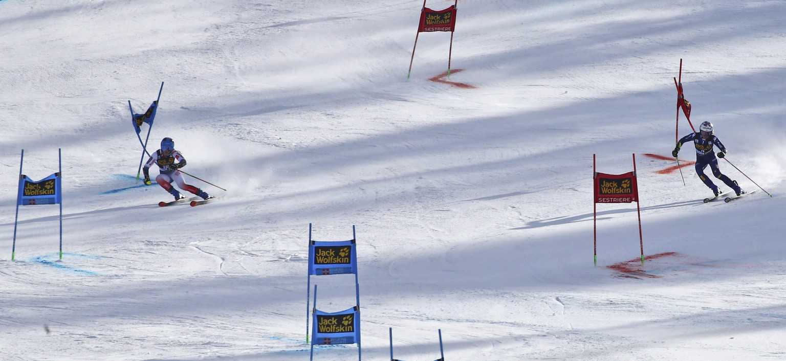 Italy&#039;s Marta Bassino, right, and France&#039;s Clara Direz compete during an alpine ski, women&#039;s World Cup parallel giant slalom in Sestriere, Italy, Sunday, Jan. 19, 2020. (AP Photo/ Marco ...