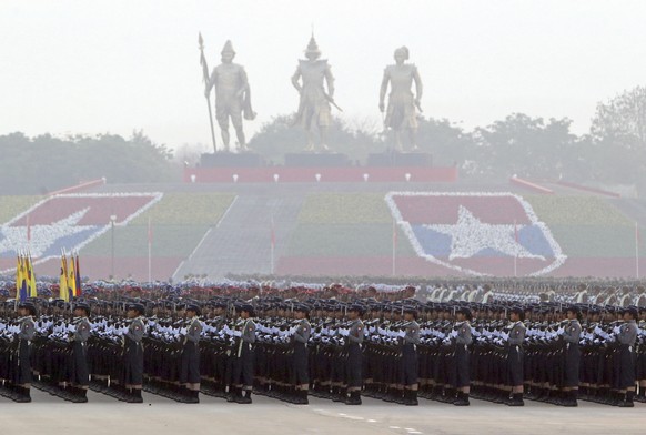 FILE - In this March 27, 2019, file photo, Myanmar military officers stand in a formation during a parade to mark the 74th Armed Forces Day in Naypyitaw, Myanmar. A United Nations fact-finding mission ...
