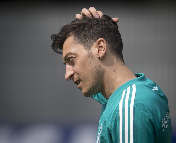 FILE - In this June 14, 2018 file photo Mesut Ozil scratches his head during a training session of the German team at the 2018 soccer World Cup in Vatutinki near Moscow, Russia. (AP Photo/Michael Prob ...