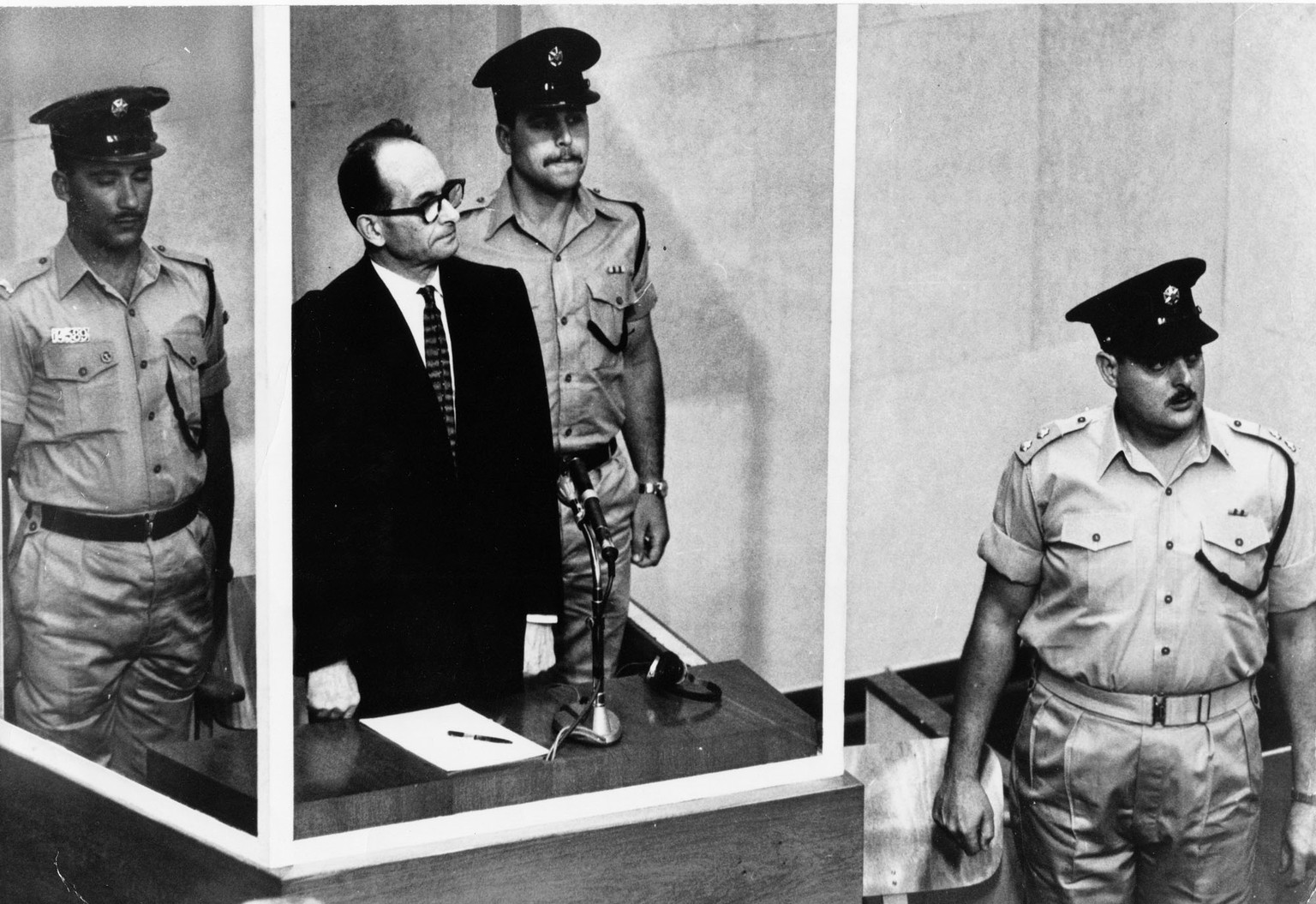 FILE - The 1961 file photo shows Adolf Eichmann standing in his glass cage in the Jerusalem courtroom where he was tried for war crimes committed during World War II. Germany’s highest court has rejec ...