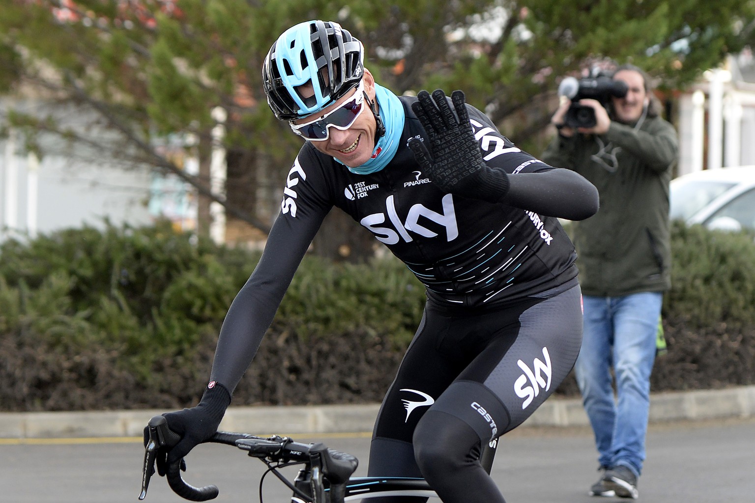 Four-time Tour de France champion Chris Froome of Britain waves while training in Palma de Mallorca, Balearic island of Mallorca, Spain, Thursday Dec. 14, 2017. Froome says a &quot;wealth of informati ...