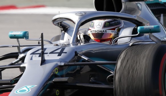 Mercedes driver Lewis Hamilton of Britain steers his car during a Formula One pre-season testing session at the Barcelona Catalunya racetrack in Montmelo, outside Barcelona, Spain, Thursday, Feb.21, 2 ...