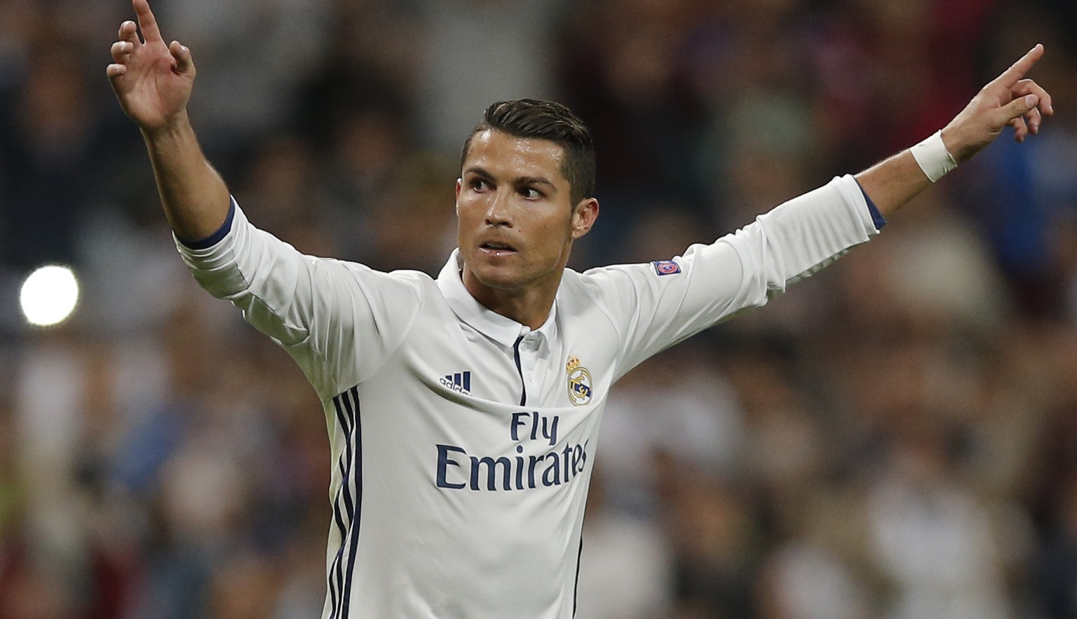 Real Madrid&#039;s Cristiano Ronaldo celebrates scoring his side&#039;s first goal during a Champions League, Group F soccer match between Real Madrid and Sporting, at the Santiago Bernabeu stadium in ...